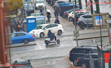 Crazy Bicycle Crossing Amsterdam